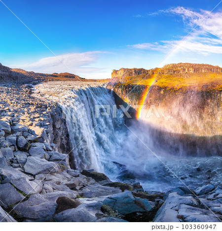 Breathtaking sunrise view of the most powerful waterfall in Europe called Dettifoss with rainbow 103360947