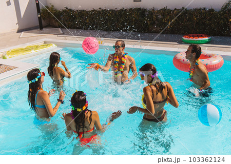 Group of friend play together in the swimming pool 103362124