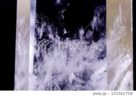 Macro mineral stone Crystal rock crystal on a black background 103362709