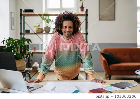 Portrait of young multiracial man in office. Portrait of young multiracial man in office. 103363206