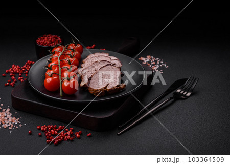 Delicious beef steak with salt, spices and herbs on a ceramic plate Delicious beef steak with salt, spices and herbs on a ceramic plate 103364509