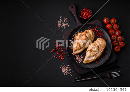 Delicious fresh grilled chicken fillet with salt, spices and herbs on a ceramic plate Delicious fresh grilled chicken fillet with salt, spices and herbs on a ceramic plate 103364541