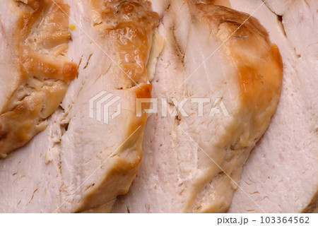 Delicious fresh grilled chicken fillet with salt, spices and herbs on a ceramic plate 103364562