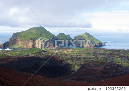 Heimaey town aerial view from Eldfell volcano. Heimaey town aerial view from Eldfell volcano. 103365206
