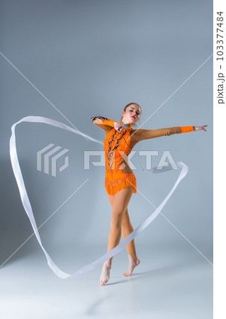 beautiful Caucasian girl gymnast with white ribbon beautiful Caucasian girl gymnast with white ribbon 103377484