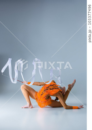 beautiful Caucasian girl gymnast with white ribbon beautiful Caucasian girl gymnast with white ribbon 103377496