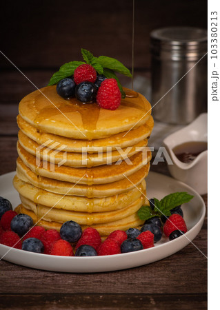 Recipe for maple syrup pancakes with raspberry and blueberry filling 103380213
