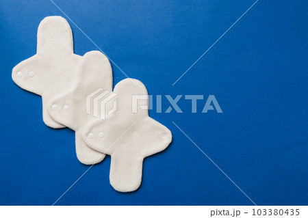 Eco-friendly reusable fabric women's pads. set of colorful bright reusable menstrual pads. zero waste woman periods concept top view with copy space 103380435