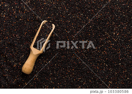 black quinoa grain in wooden spoon background and texture of gluten free top view black quinoa grain in wooden spoon background and texture of gluten free top view 103380586