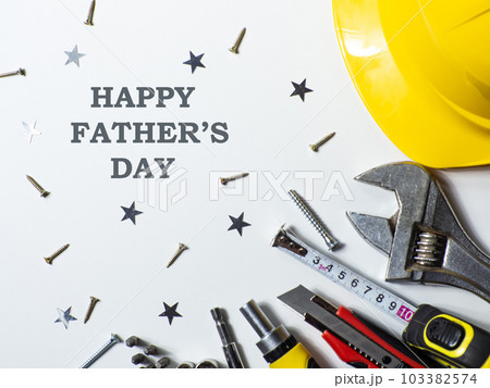 Construction tools, hard hat on white background with Happy Fathers day Construction tools, hard hat on white background with Happy Fathers day 103382574