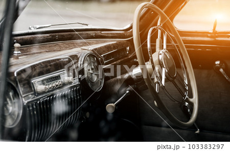 Steering wheel of a classic automobile. Steering wheel of a classic automobile. 103383297