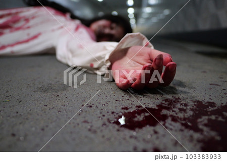 Scary woman in white dress with bloodstain after murder, Halloween concept Scary woman in white dress with bloodstain after murder, Halloween concept 103383933
