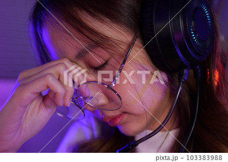 Female gamer having eye strain and headache after lose game close up 103383988