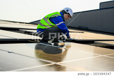 Engineer technician with safety helmet working with solar power station Engineer technician with safety helmet working with solar power station 103384347