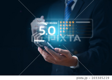 Businessman pressing smiley face emoticon on virtual screen 103385219