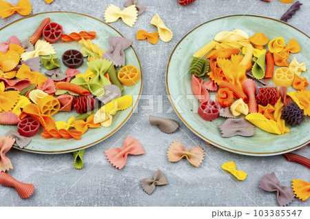 Colorful raw farfalle pasta Colorful raw farfalle pasta 103385547