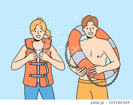 Smiling lifeguards in vest and lifebuoy  Smiling lifeguards in vest and lifebuoy  103386384