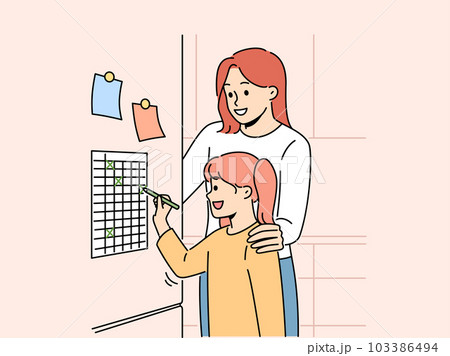 Smiling mother and daughter check tasks on to do list  103386494