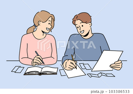 Smiling couple sit at desk managing finances Smiling couple sit at desk managing finances 103386533