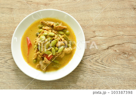 spicy boiled pork and  Nitta tree seed or luk rieng in coconut milk curry soup Thai southern food on plate 103387398