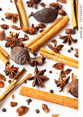 Dried star anise, cinnamon sticks and whole cardamon. Natural herbal spices seasoning collection. Dried star anise, cinnamon sticks and whole cardamon. Natural herbal spices seasoning collection. 103388267