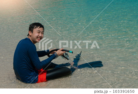 Asia boy smile for snorkeling on the beach at the sea Asia boy smile for snorkeling on the beach at the sea 103391650