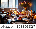 Seasonal table setting with pumpkins and flowers Seasonal table setting with pumpkins and flowers 103393327