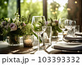 Romantic table setting with candles and flowers Romantic table setting with candles and flowers 103393332