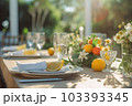 Romantic table setting with candles and flowers Romantic table setting with candles and flowers 103393345