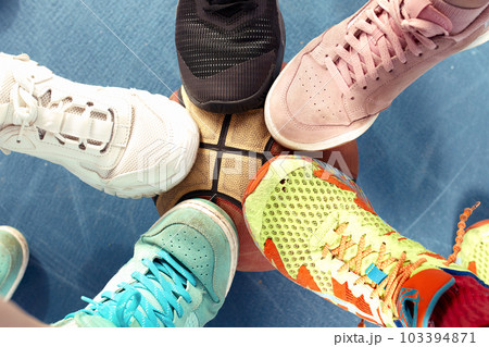 sneakers standing in the circle, view from above. Colorful sneakers standing in circle. sneakers standing in the circle, view from above. Colorful sneakers standing in circle. 103394871
