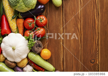 Assortment of fresh ripe vegetables on wooden background with space for text. 103395966