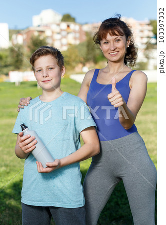 Family during break in outdoors workout Family during break in outdoors workout 103397332