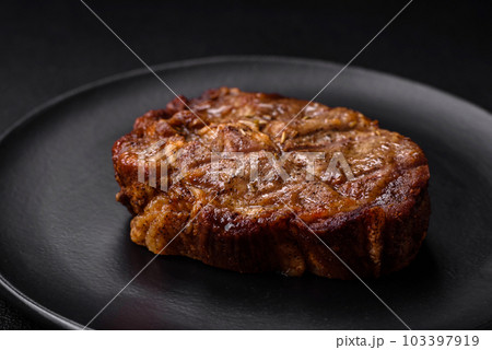 Delicious juicy pork or beef steak grilled with salt, spices and herbs Delicious juicy pork or beef steak grilled with salt, spices and herbs 103397919