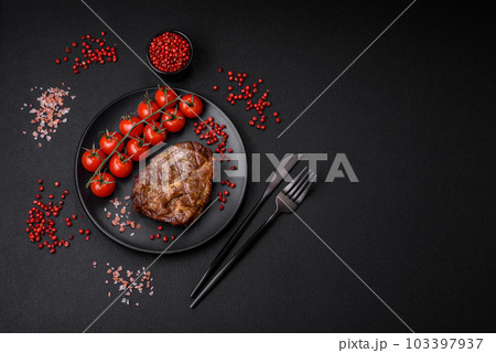 Delicious juicy pork or beef steak grilled with salt, spices and herbs 103397937