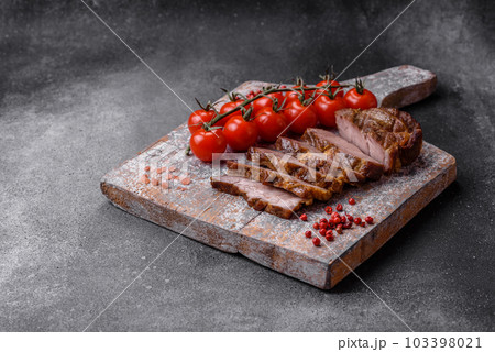 Delicious juicy pork or beef steak grilled with salt, spices and herbs Delicious juicy pork or beef steak grilled with salt, spices and herbs 103398021