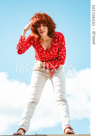 the girl looks at the camera in surprise 103401105