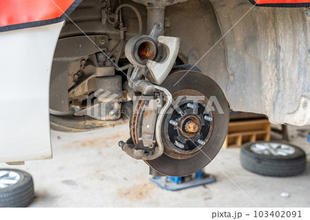 Car front disc break being checked and inspected for safety 103402091