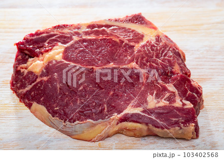 Uncooked beef chop Uncooked beef chop 103402568