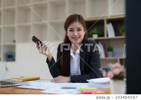 Beautiful business woman talking on the mobile phone. Management, planning and networking phone call concept 103404587