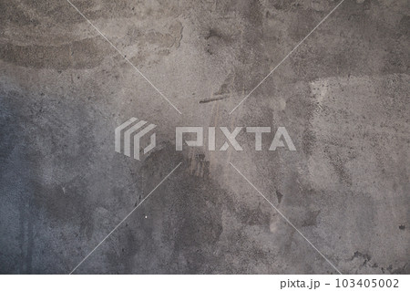 The texture of a gray stone wall with lightened spots. An overlay for your design with copy space. High quality photo 103405002