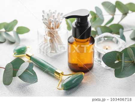 Natural skin care and aromatherapy with eucalyptus essential oil bottle, beauty jade roller, 103406718