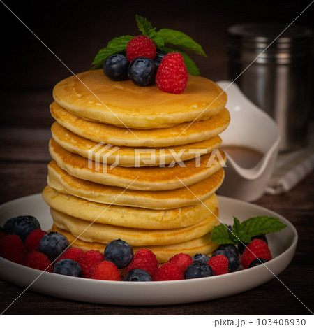 Recipe for maple syrup pancakes with raspberry and blueberry filling Recipe for maple syrup pancakes with raspberry and blueberry filling 103408930