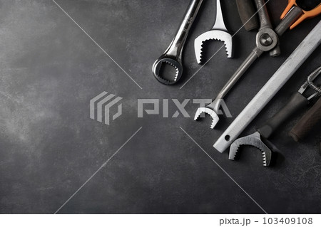 Auto mechanic's tools on grey stone table with copy space Auto mechanic's tools on grey stone table with copy space 103409108