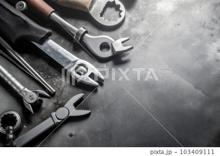 Auto mechanic's tools on grey stone table with copy space Auto mechanic's tools on grey stone table with copy space 103409111