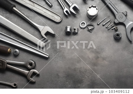 Auto mechanic's tools on grey stone table with copy space	 103409112