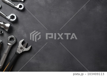 Auto mechanic's tools on grey stone table with copy space Auto mechanic's tools on grey stone table with copy space 103409113