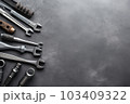 Auto mechanic's tools on grey stone table with copy space	 103409322