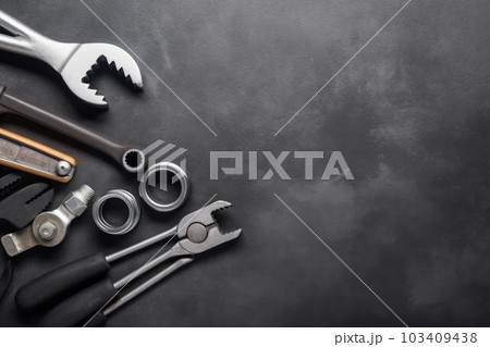 Auto mechanic's tools on grey stone table with copy space Auto mechanic's tools on grey stone table with copy space 103409438