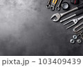 Auto mechanic's tools on grey stone table with copy space	 103409439