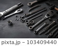 Auto mechanic's tools on grey stone table with copy space	 103409440